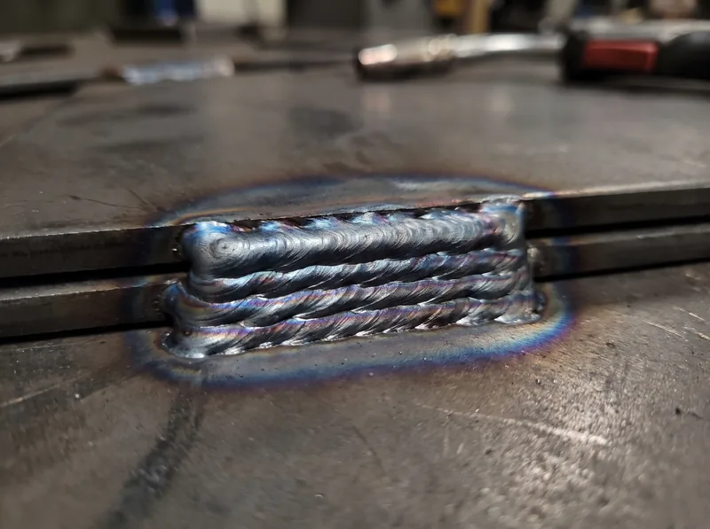 Close-up of clean MIG weld beads on steel